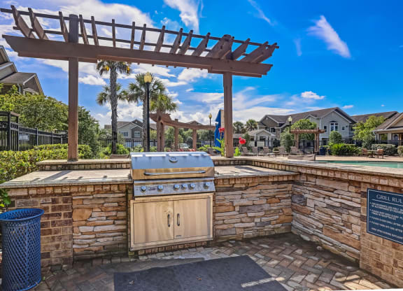 Outdoor Kitchen Area With Pergola