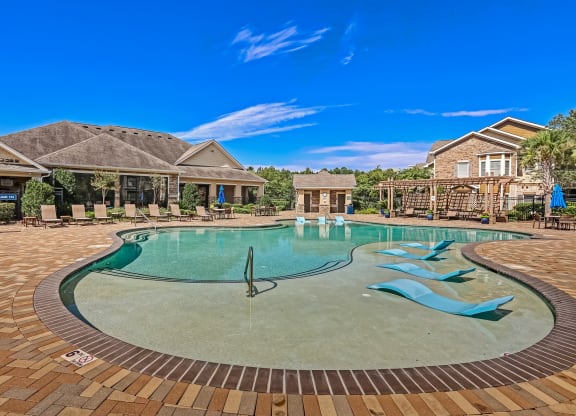 Zero-Entry Pool With Sun Loungers