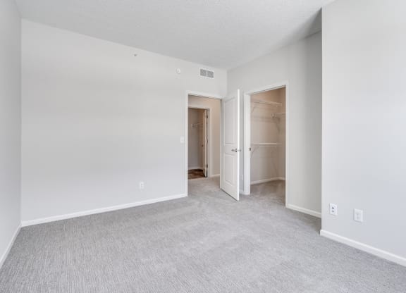 Bedroom Featuring Plush Carpeting & Attached Walk-In Closet