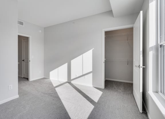 Bedroom Featuring  Lots Of Natural Light & Attached Walk-In Closet