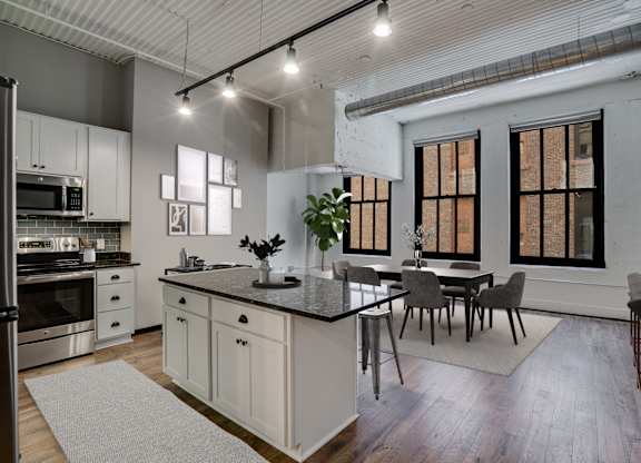 Spacious Living Area With Wood-Style Flooring