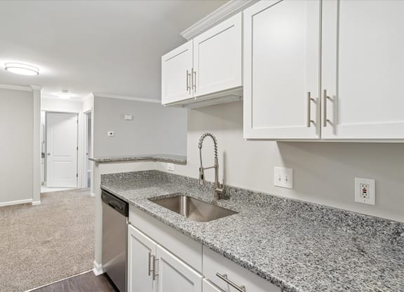 Kitchen with White Cabinetry and Stainless Steel Appliances
