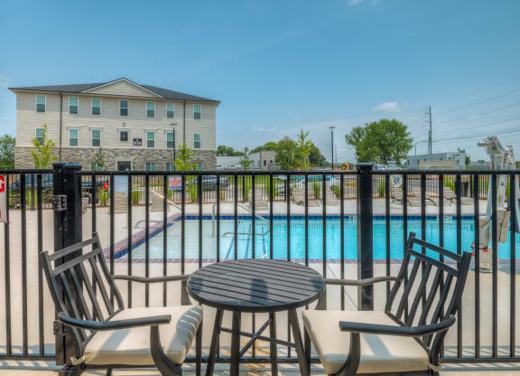 Patio seating next to pool