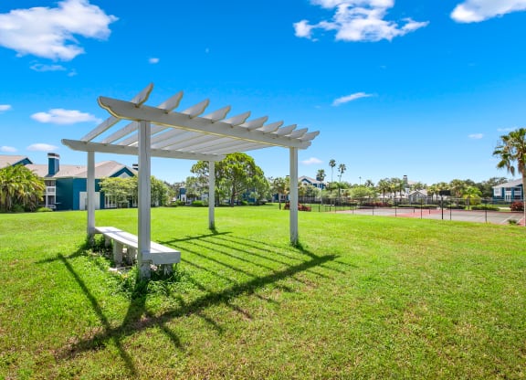 Large Open Green Space With Pergola & Bench