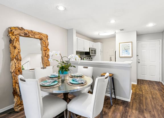 Open Concept Kitchen & Dining Room Area With Wood-Style Flooring