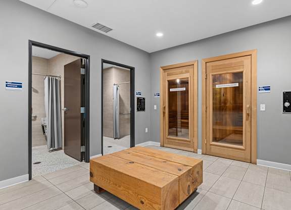 A room with a wooden table and four doors.