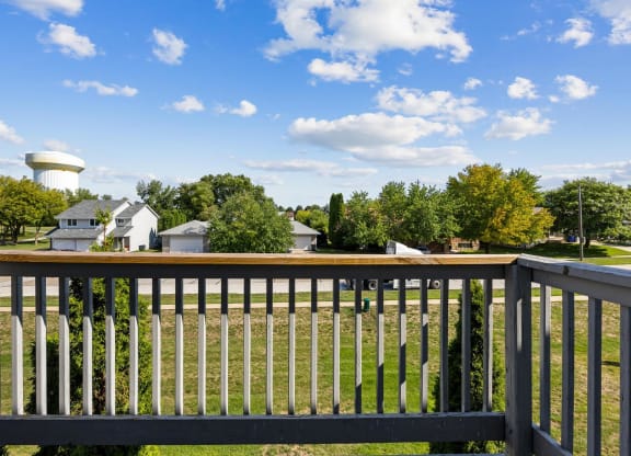 a view from the deck of a home with a water tower in the background