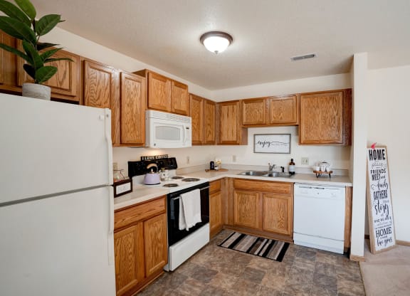 Fully-Equipped Kitchen With White Appliances