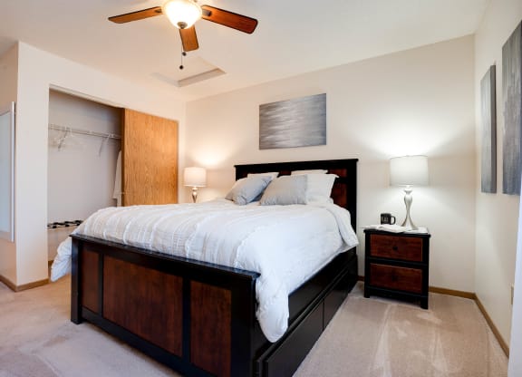 Bedroom With Ceiling Fan & Sliding Closet Door
