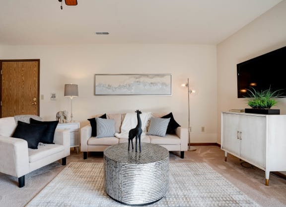 Carpeted Living Room With Light Beige Walls