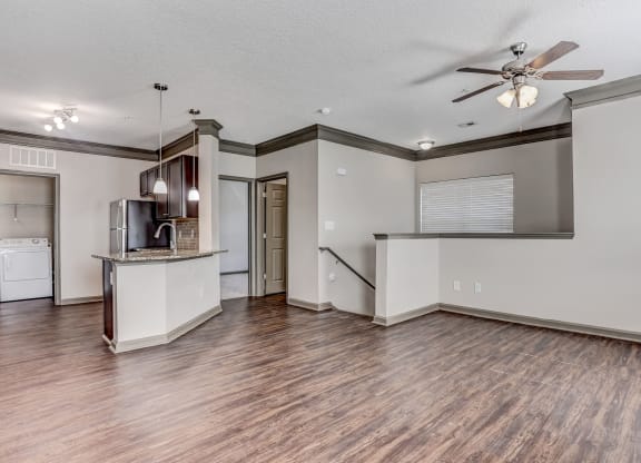 Stairwell Leading Up To The Living Area With Wood-Style Floors