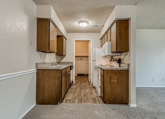 Kitchen with Wood Cabinetry and Granite Countertops