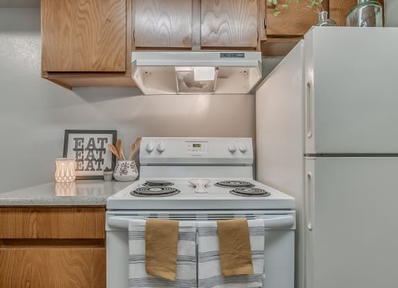 Kitchen Featuring White Appliances