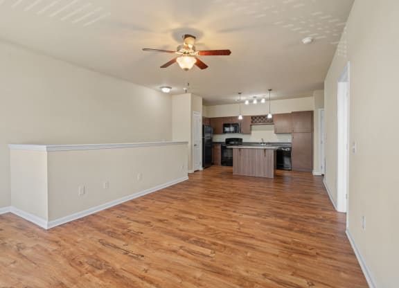 Spacious Living Area With Wood-Style Flooring