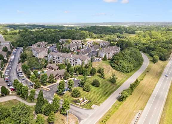 A bird's eye view of a residential area with houses and trees.