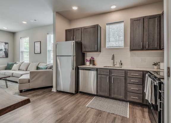 Kitchen with Dark Brown Cabinetry and Stainless Steel Appliances