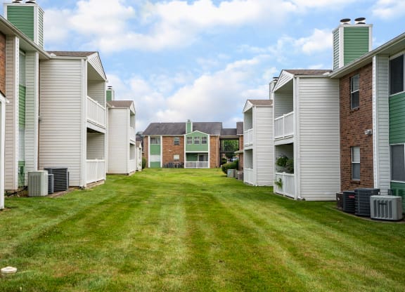 Green Grass Area Between Rivergate Meadows Apartment Homes