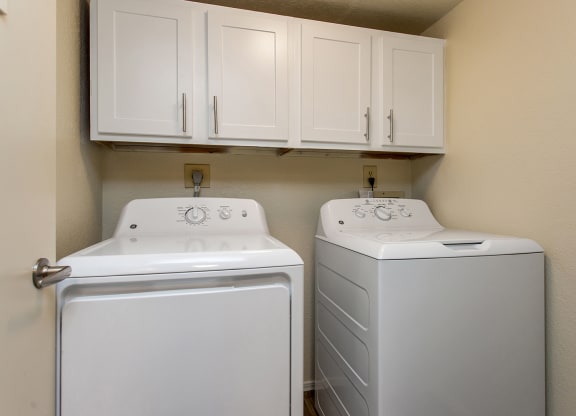 Washer & Dryer With Built-In Cabinets Above