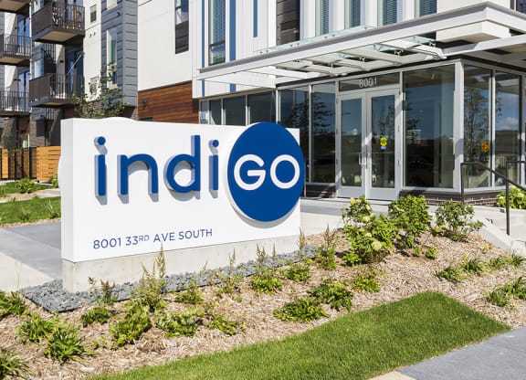 Indigo Monument Sign In Front Of Building