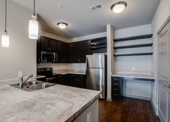 Kitchen with Espresso Cabinetry and Built-In Wine Rack