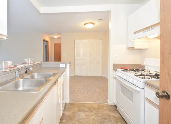 Kitchen with Light Grey Countertops and Tile Style Flooring