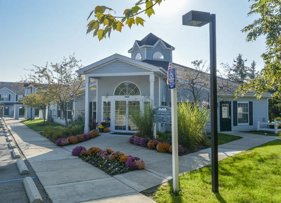 Exterior of the Green Meadows Clubhouse with Manicured Landscaping