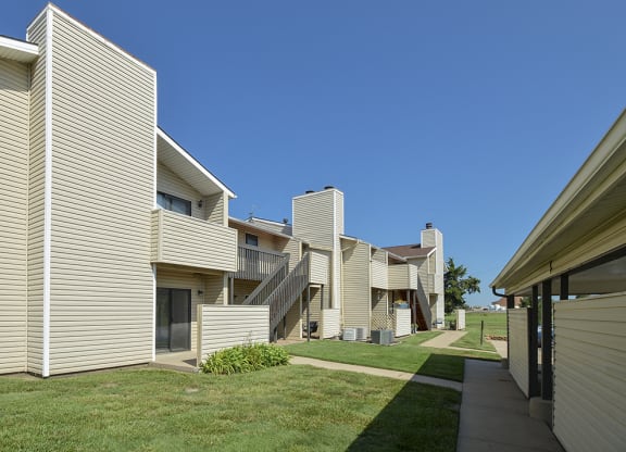 Exterior Patios and Balconies with Partial Privacy Walls with Lush Grass
