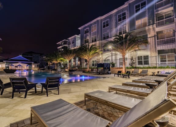 Resort-Style Pool & Sundeck Lit Up At Night