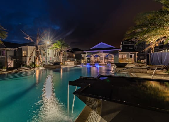 Resort-Style Pool Lit Up At Night