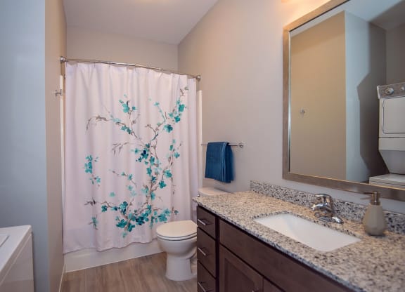 Bathroom with Stacked Washer and Dryer