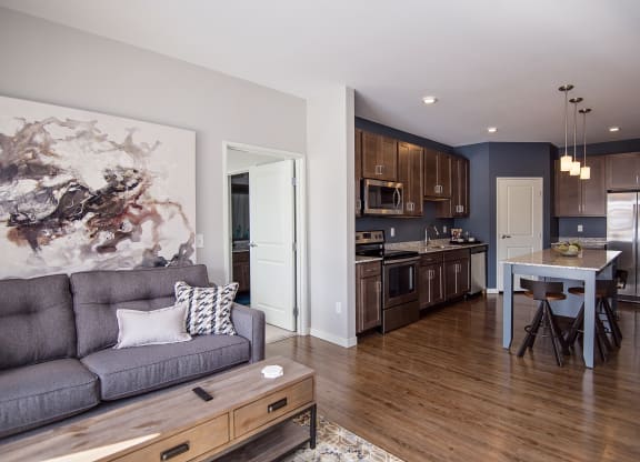 Open Concept Living with Wood Style Flooring Throughout the Kitchen and Living Room