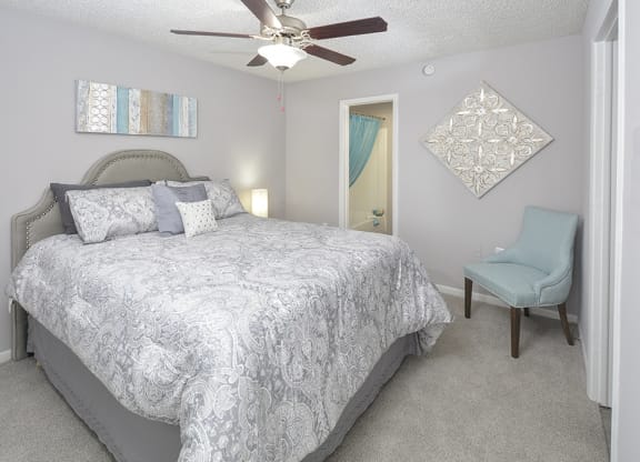 Bedroom with Plush Carpeting and Attached Bathroom