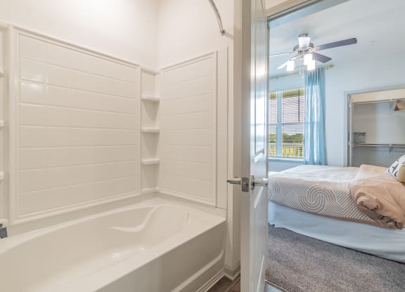 Spacious Shower & Tub With Built-In Shelving