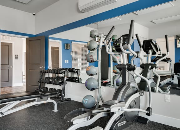 Elliptical & Free Weights At The Fitness Center