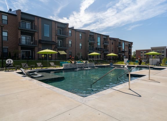 Resort-Style Pool With Fountains & Sun Lounger Chairs