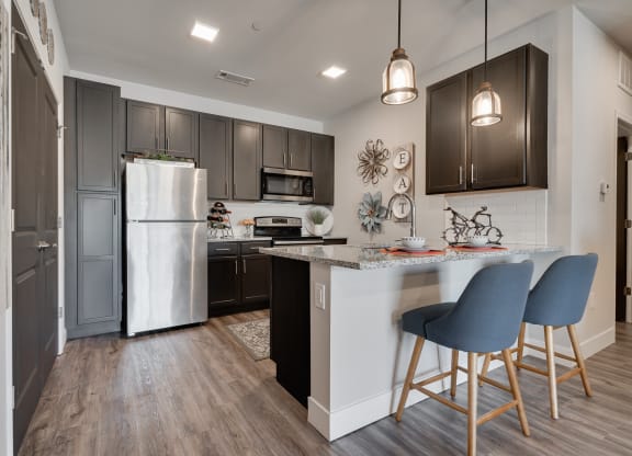 Kitchen With Granite Countertops & White Subway Tile Backsplash