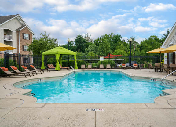Pool Lounge Furniture with Cabana and Sun Umbrellas