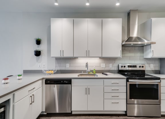 Kitchen with White Cabinetry and Stainless Steel Appliances