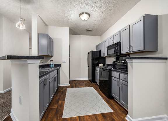 Fully-Equipped Kitchen with Black Appliances