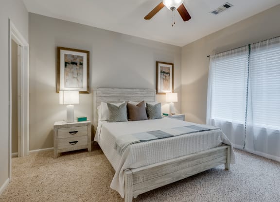Carpeted Bedroom With Tall Ceilings
