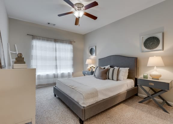 Bedroom With Tall Ceilings & Large Windows