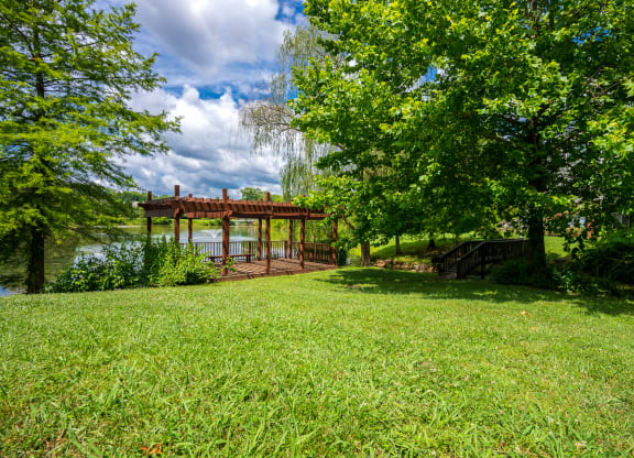 Pergola & Lush Grass Area Overlooking The Pond Area