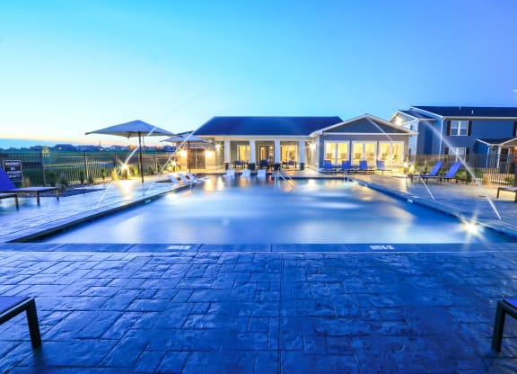 Resort-Style Pool Lit Up At Night