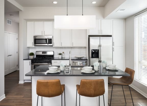 Beautiful Kitchen With Light Cabinetry & Stainless Steel Appliances