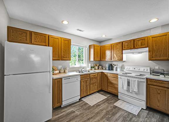 Fully Equipped Kitchen with White Appliances