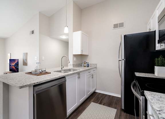 Kitchen with White Cabinetry and Stainless Steel Appliances