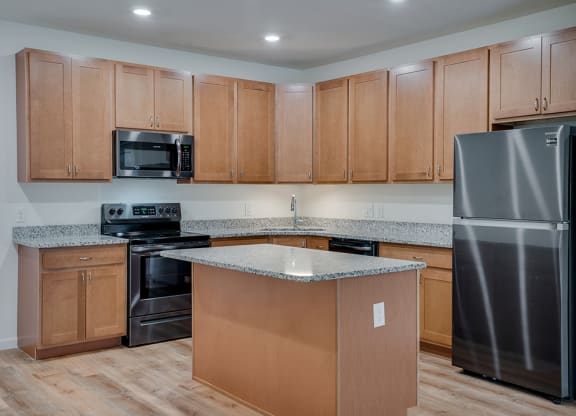 Kitchen with Stainless Steel Appliances with Recessed Lighting