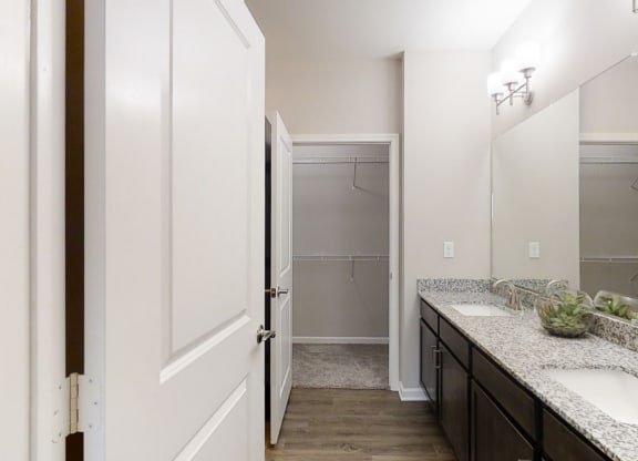 Bathroom Vanity with Double Sinks and Attached Walk-In Closet