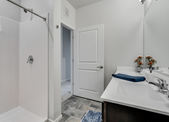 Bathroom With Walk-In Shower With Tile Flooring