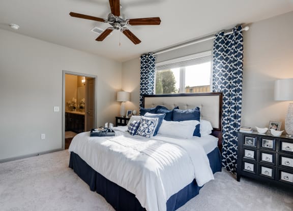 Bedroom With Tall Ceilings & Large Windows